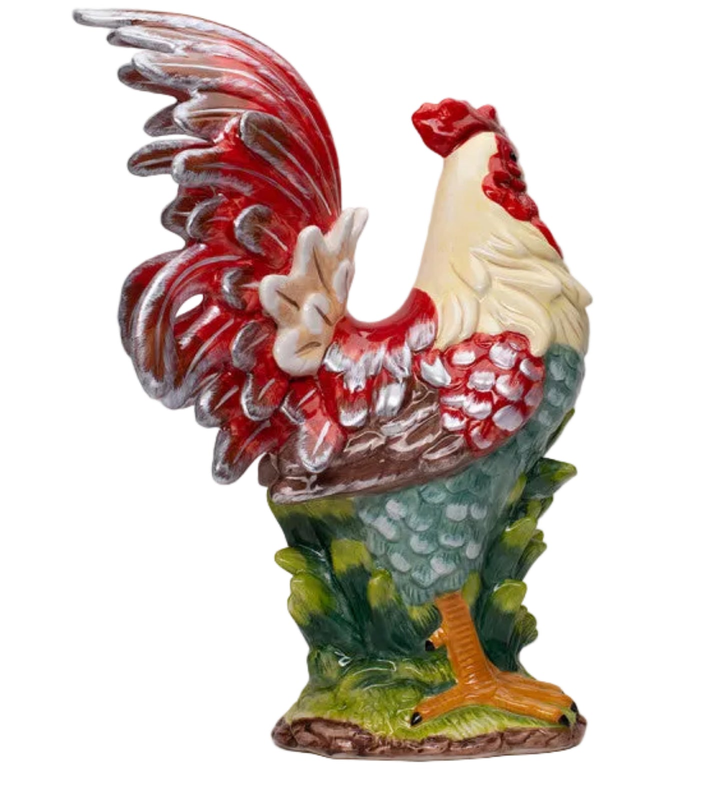 A ceramic rooster figurine with a red and cream body, green and blue patterned tail feathers, and yellow legs, standing on a small grassy base against a neutral gray background.