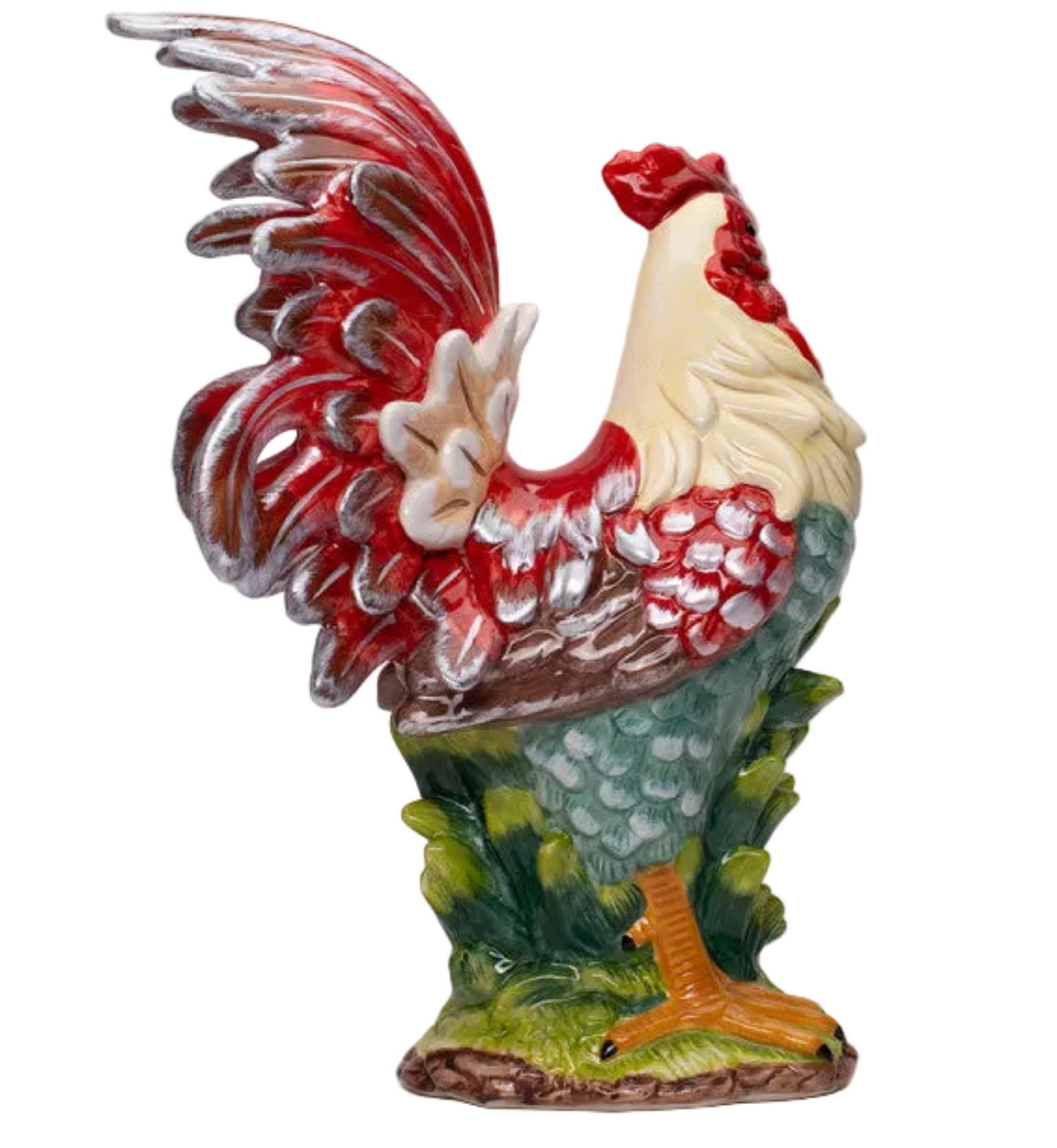 A ceramic rooster figurine with a red and cream body, green and blue patterned tail feathers, and yellow legs, standing on a small grassy base against a neutral gray background.
